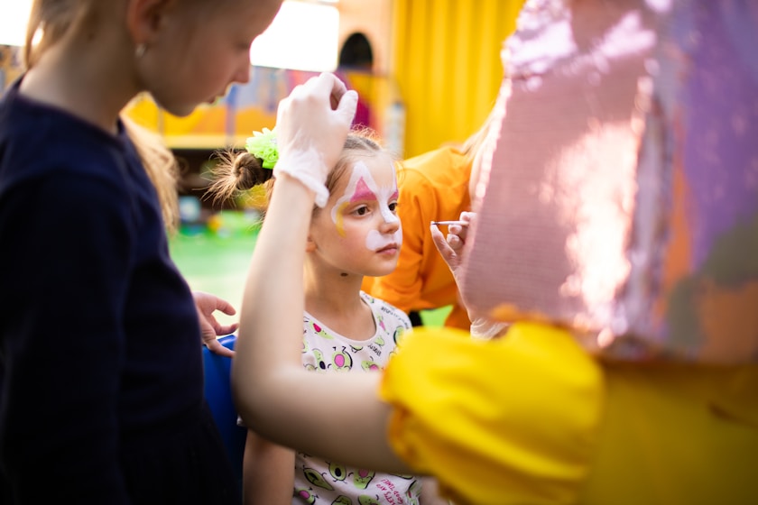 A girl having her face painted