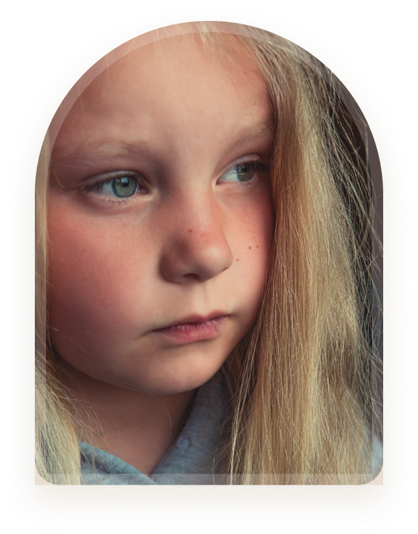 A girl looking to the side with a thoughtful expression