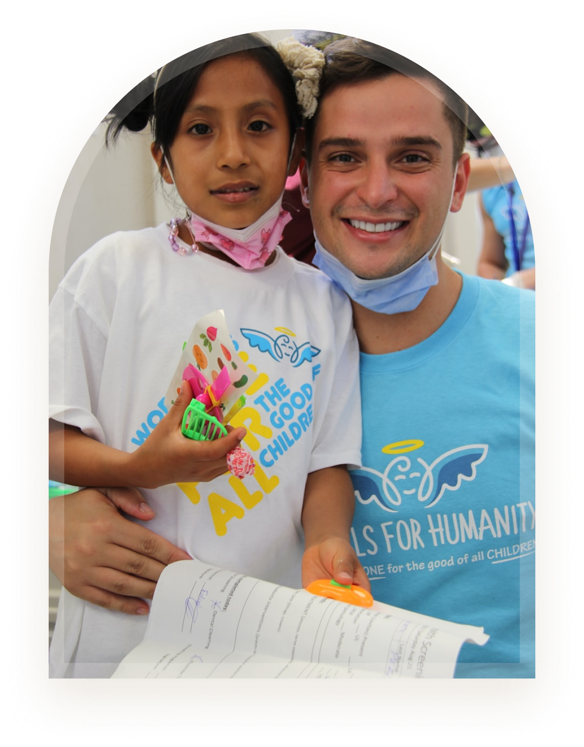 A clinician and young girl smiling together during a supportive visit
