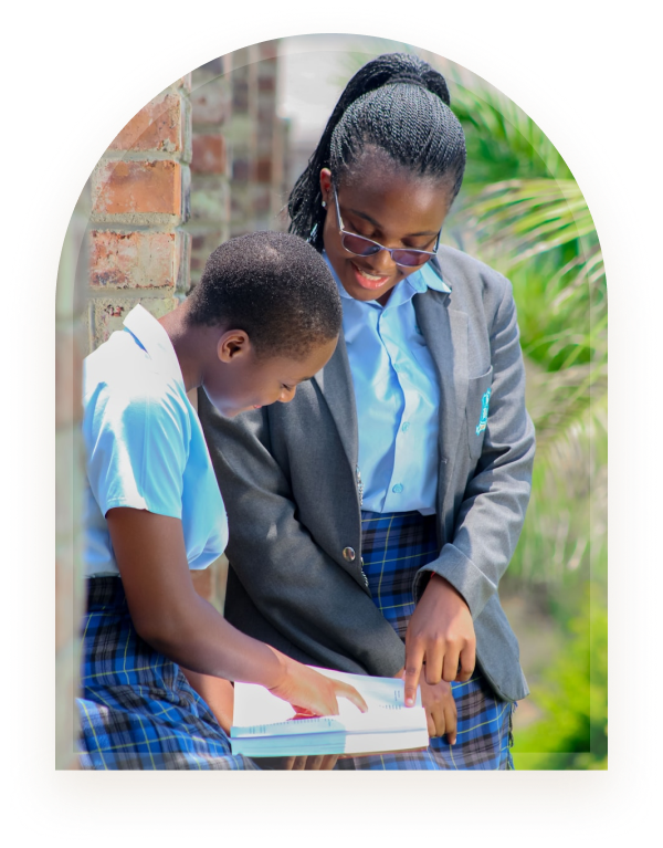 Two students in school uniform studying together outdoors